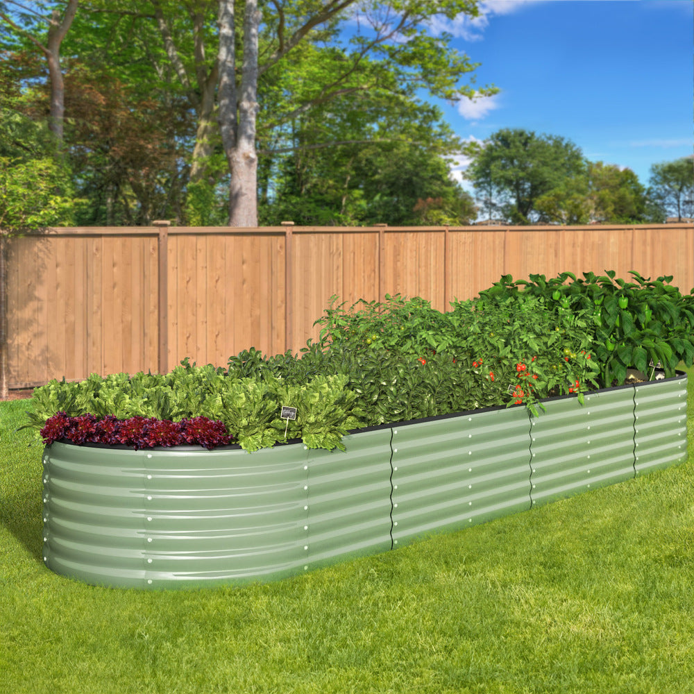 Extra-long green steel garden bed for growing vegetables and flowers in organised rows